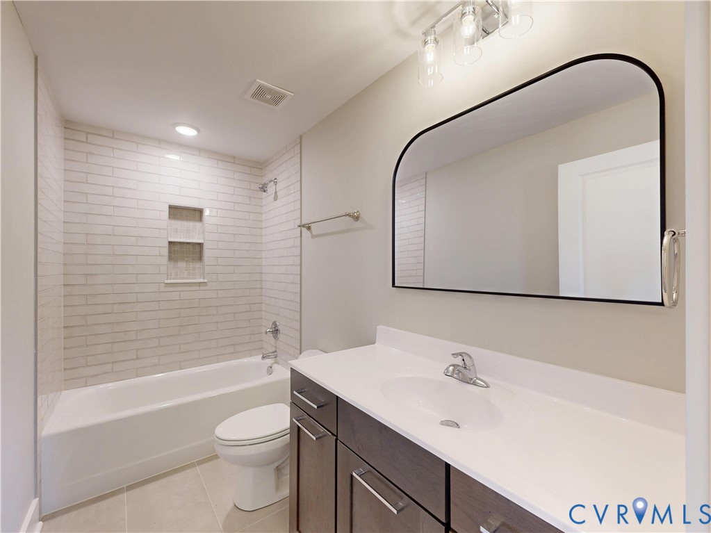 15085 Lebanon Road Spring Grove, VA 23881 - Photo 11 of 16 a bathroom with a bathtub shower sink mirror and toilet