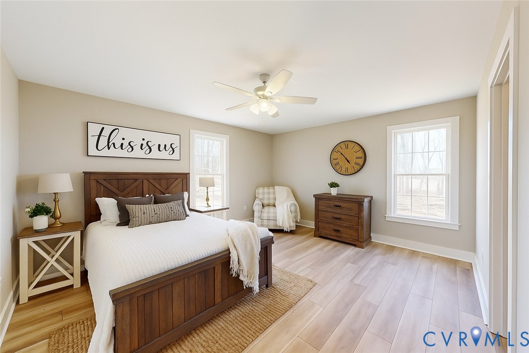 15085 Lebanon Road Spring Grove, VA 23881 - Photo 4 of 16 a bedroom with a bed and a chandelier