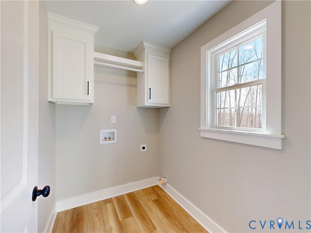 15085 Lebanon Road Spring Grove, VA 23881 - Photo 6 of 16 a view of a room with wooden floor and cabinet