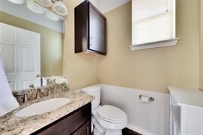 2947 Moss Street Austin, TX 78722 - Photo 11 of 15 Bathroom with vanity and toilet