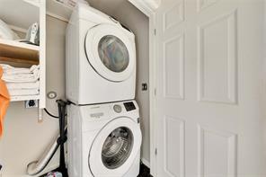 2947 Moss Street Austin, TX 78722 - Photo 13 of 15 Washroom with stacked washing machine and dryer