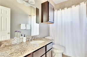 2947 Moss Street Austin, TX 78722 - Photo 9 of 15 Bathroom featuring toilet and vanity