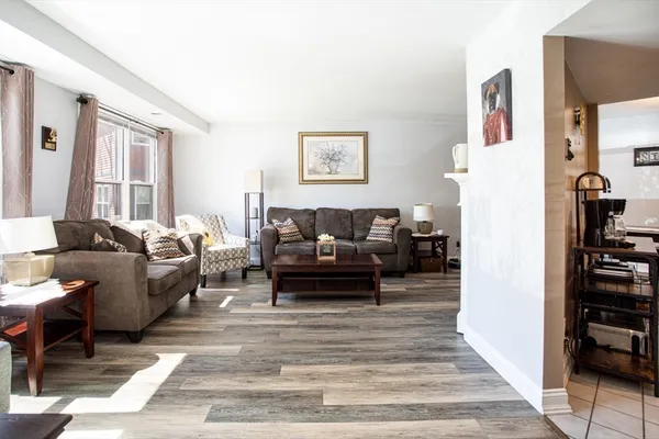a living room with furniture and a rug