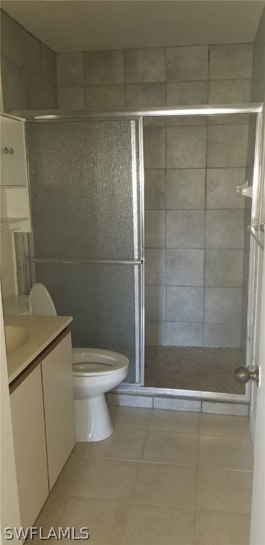 5277 Treetops Drive, Unit W204 Naples, FL 34113 - Photo 12 of 19 a bathroom with a toilet and a shower