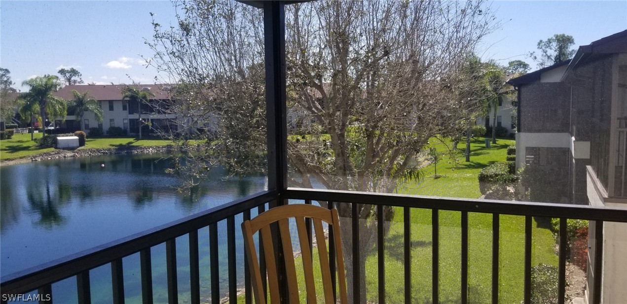 5277 Treetops Drive, Unit W204 Naples, FL 34113 - Photo 18 of 19 a view of a lake from a balcony