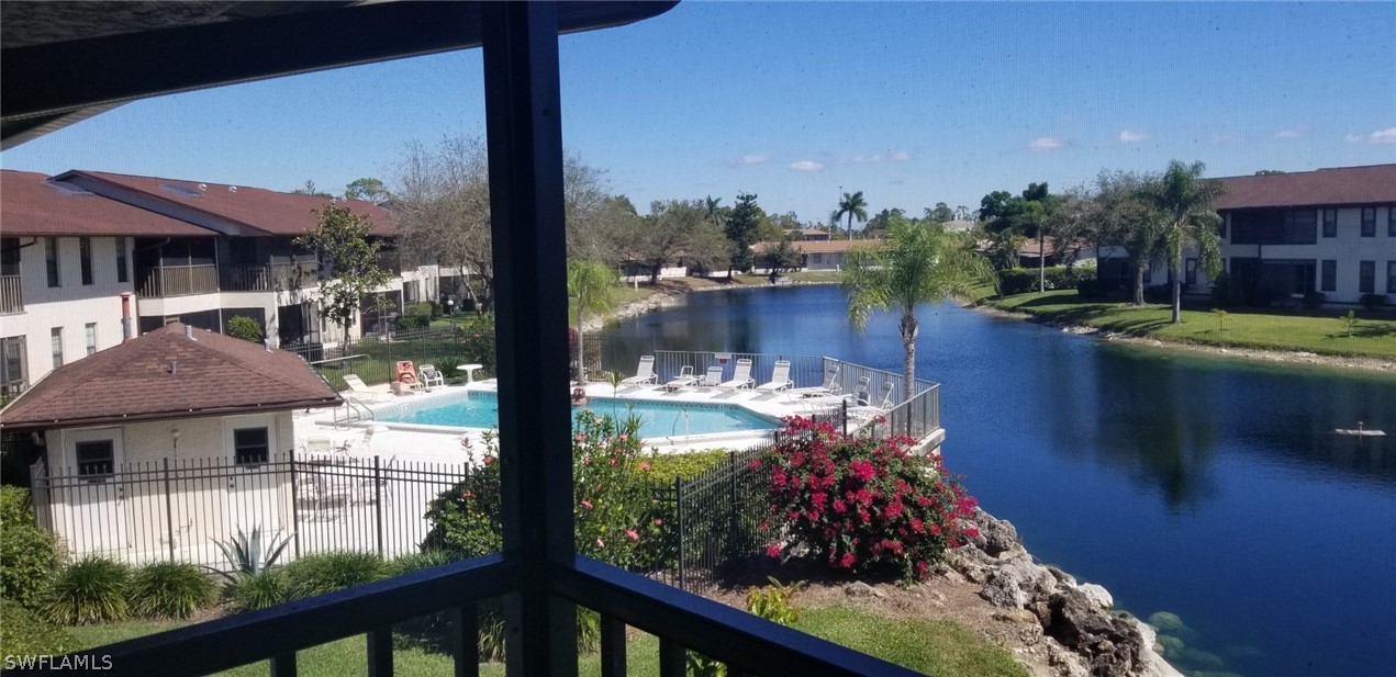 5277 Treetops Drive, Unit W204 Naples, FL 34113 - Photo 2 of 19 a view of a lake from a balcony
