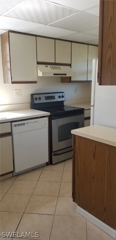 5277 Treetops Drive, Unit W204 Naples, FL 34113 - Photo 5 of 19 a kitchen with stainless steel appliances granite countertop a sink and a stove