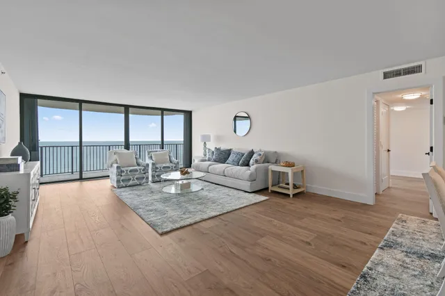 a living room with furniture and a table