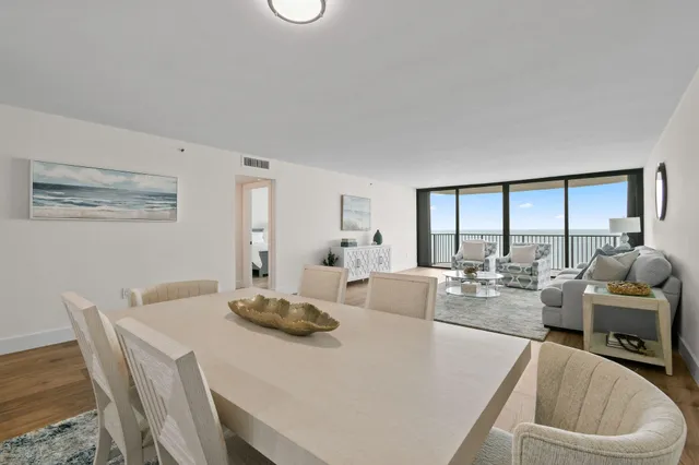 a view of a dining room with furniture and wooden floor