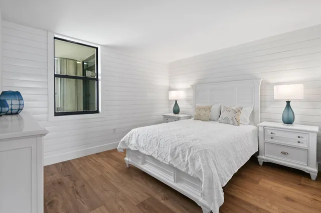 a bedroom with bed and window