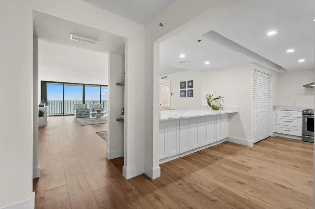 a view of kitchen with furniture and wooden floor