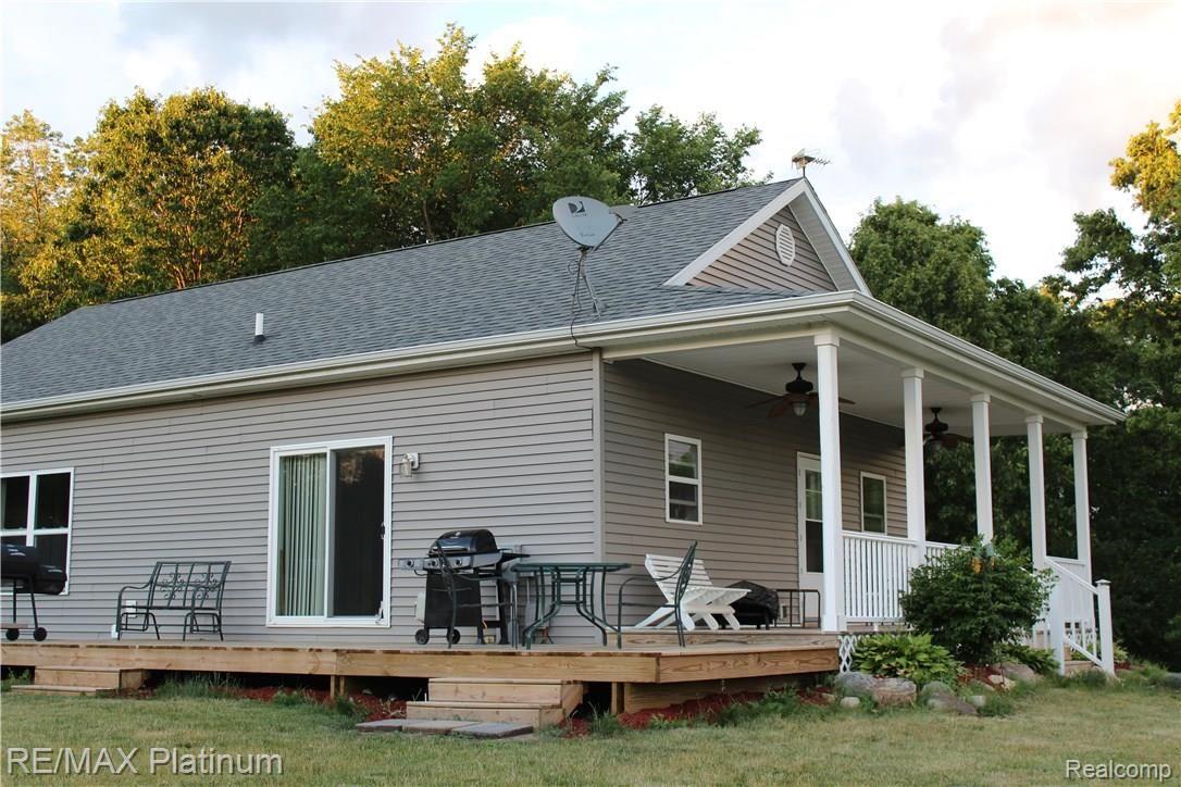 6691 Mabley Hill Road Fenton, MI 48430 - Photo 6 of 28 Enjoy easy access to outside living from sliding door and side entrance.