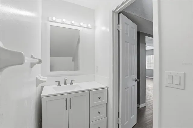 a bathroom with a sink double vanity and a mirror