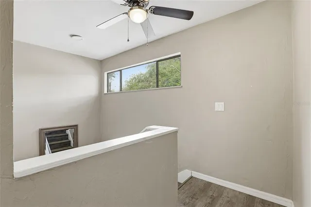 a view of an empty room with a window