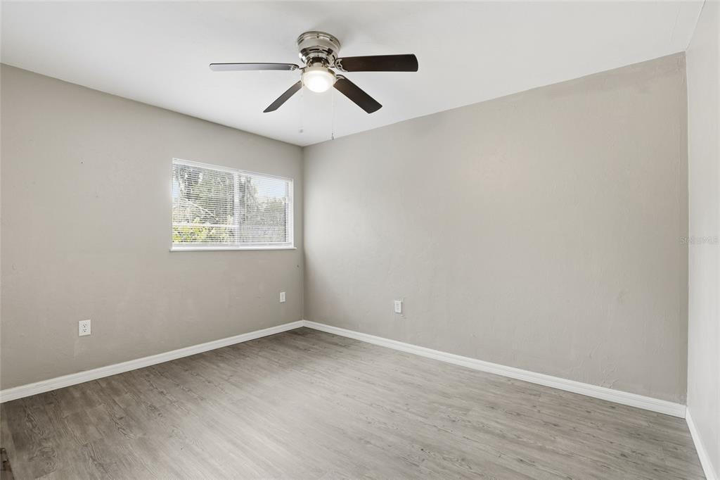 207 Southwest 6th Avenue Gainesville, FL 32601 - Photo 16 of 24 a view of room with a ceiling fan and window