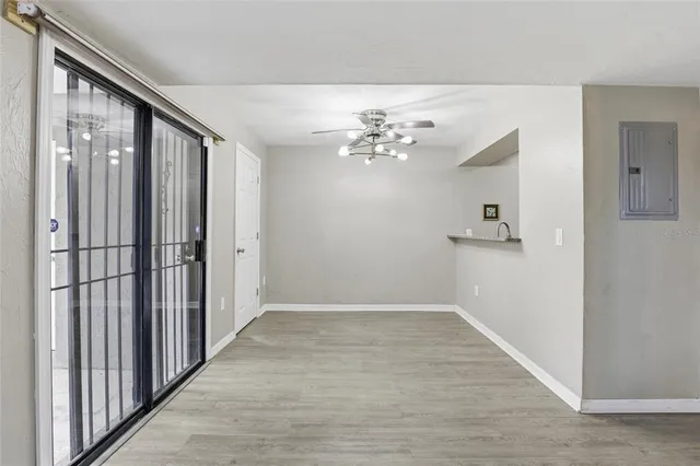 wooden floor in an empty room with a mirror