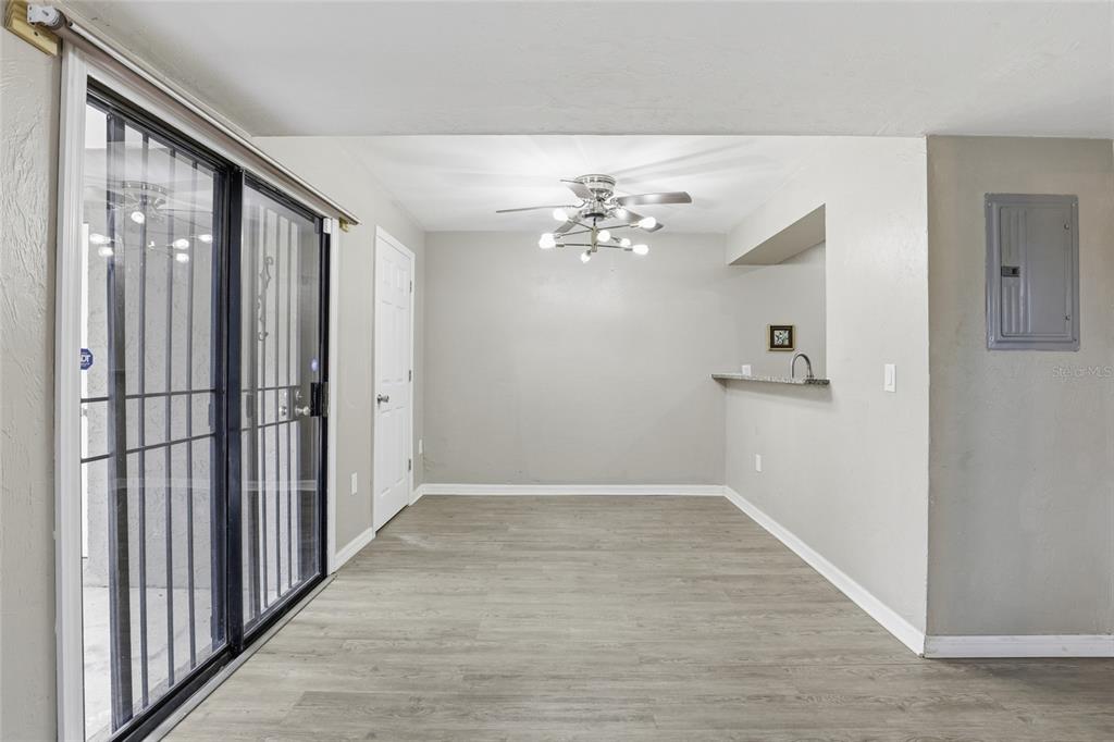 207 Southwest 6th Avenue Gainesville, FL 32601 - Photo 8 of 24 wooden floor in an empty room with a mirror