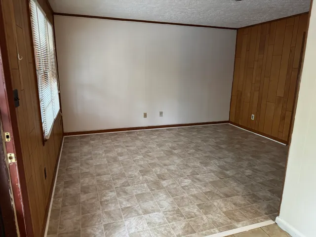 a kitchen with stainless steel appliances granite countertop a refrigerator a stove a sink and a refrigerator