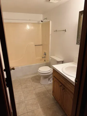 a view of a room with a wooden door