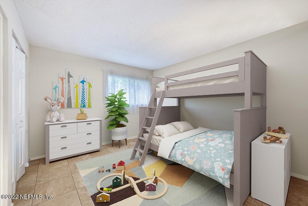 3801 Crown Point Road, Unit 3082 Jacksonville, FL 32257 - Photo 15 of 23 a bedroom with a bed and a dresser