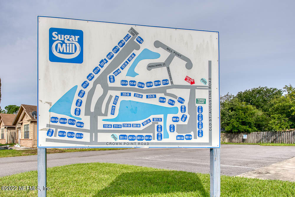 3801 Crown Point Road, Unit 3082 Jacksonville, FL 32257 - Photo 22 of 23 a view of a street with a building in the background