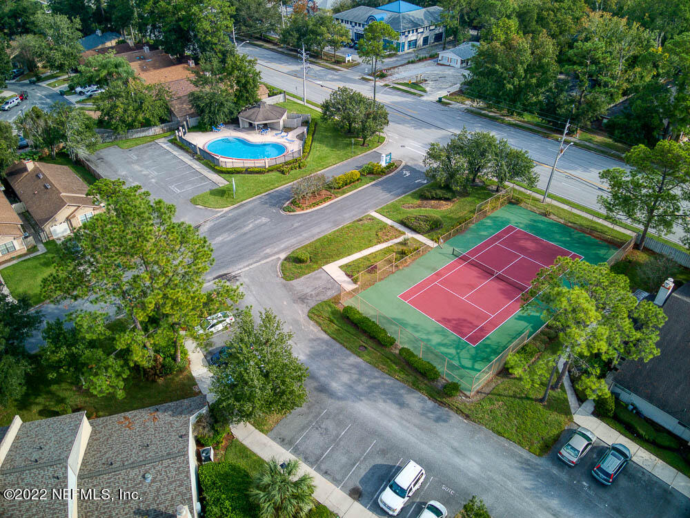 3801 Crown Point Road, Unit 3082 Jacksonville, FL 32257 - Photo 23 of 23 an aerial view of a tennis ground and a yard