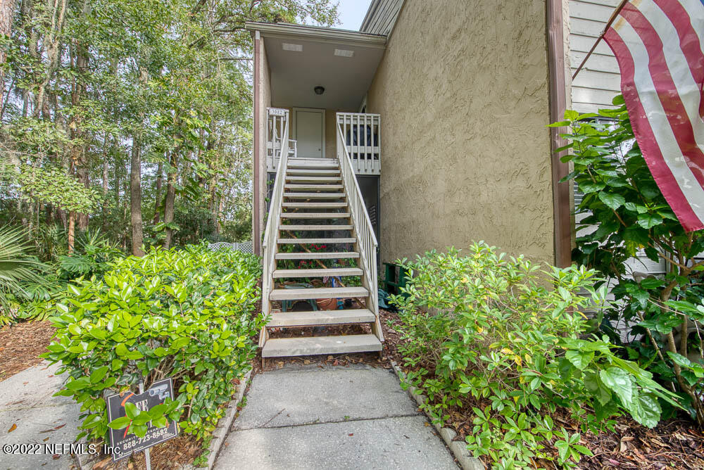 3801 Crown Point Road, Unit 3082 Jacksonville, FL 32257 - Photo 7 of 23 a view of a house with a yard