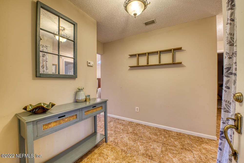 3801 Crown Point Road, Unit 3082 Jacksonville, FL 32257 - Photo 9 of 23 a room with storage and utility