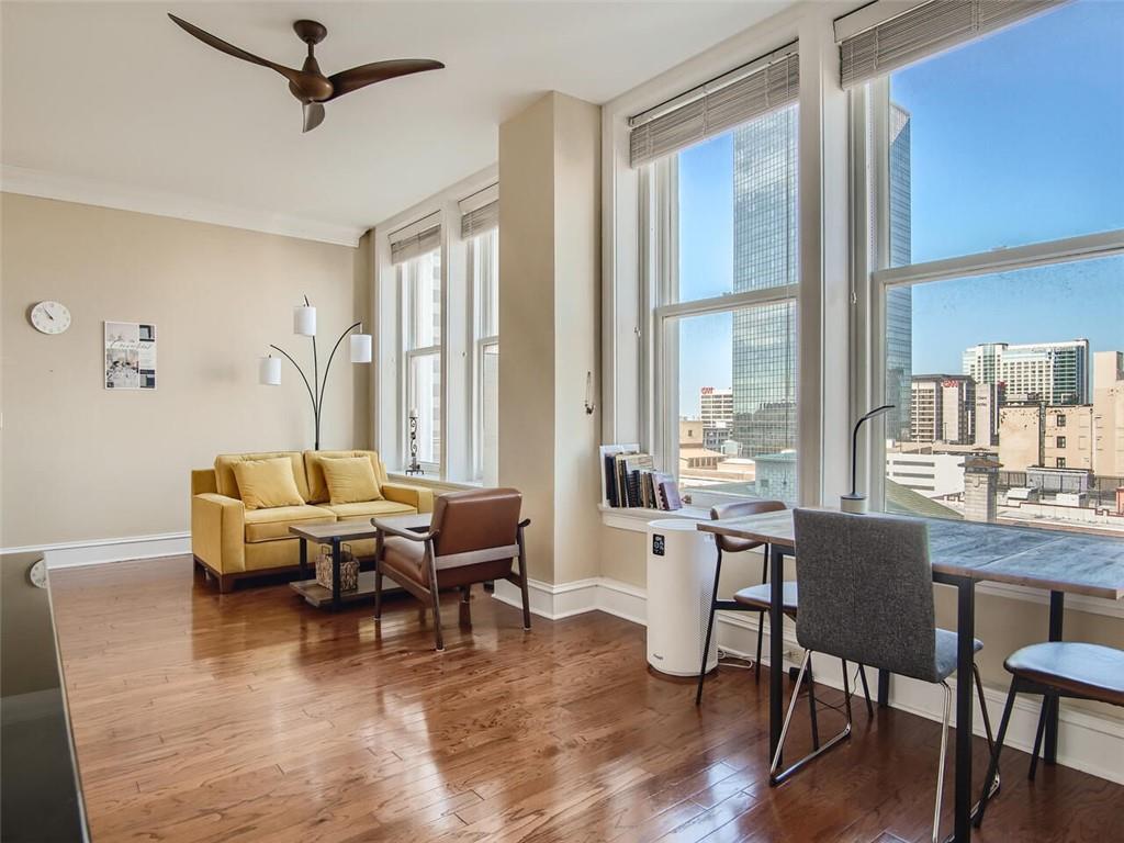 57 Forsyth Street Northwest, Unit 9C Atlanta, GA 30303 - Photo 2 of 11 a living room with furniture and large windows