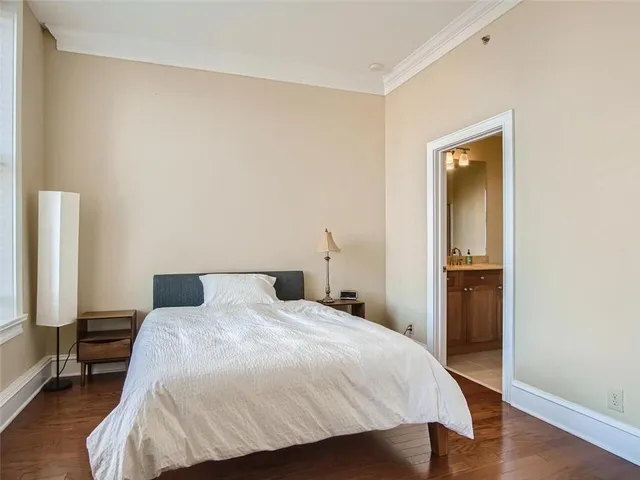 a bedroom with a bed and a table