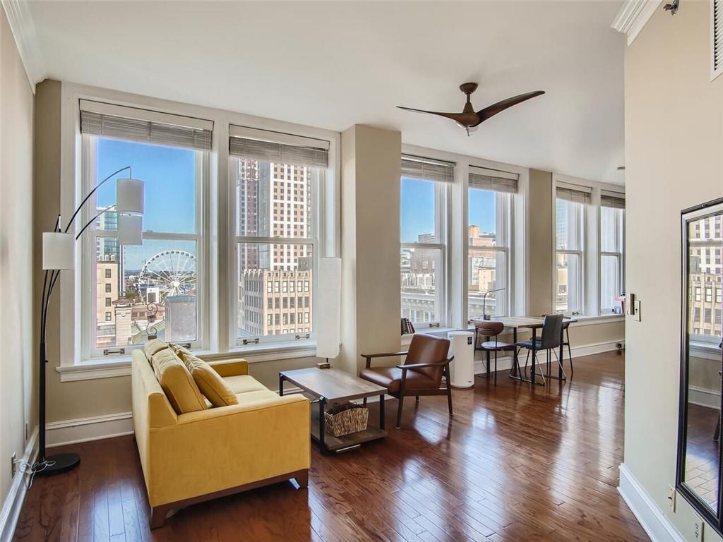 57 Forsyth Street Northwest, Unit 9C Atlanta, GA 30303 - Photo 6 of 11 a living room with furniture and a large window