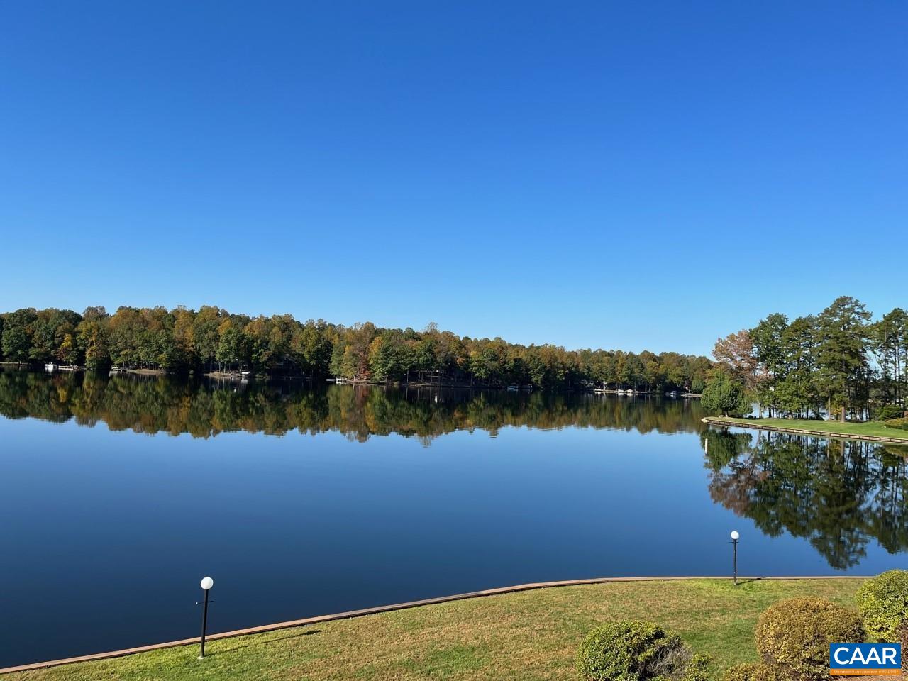 a view of a lake with houses in the background