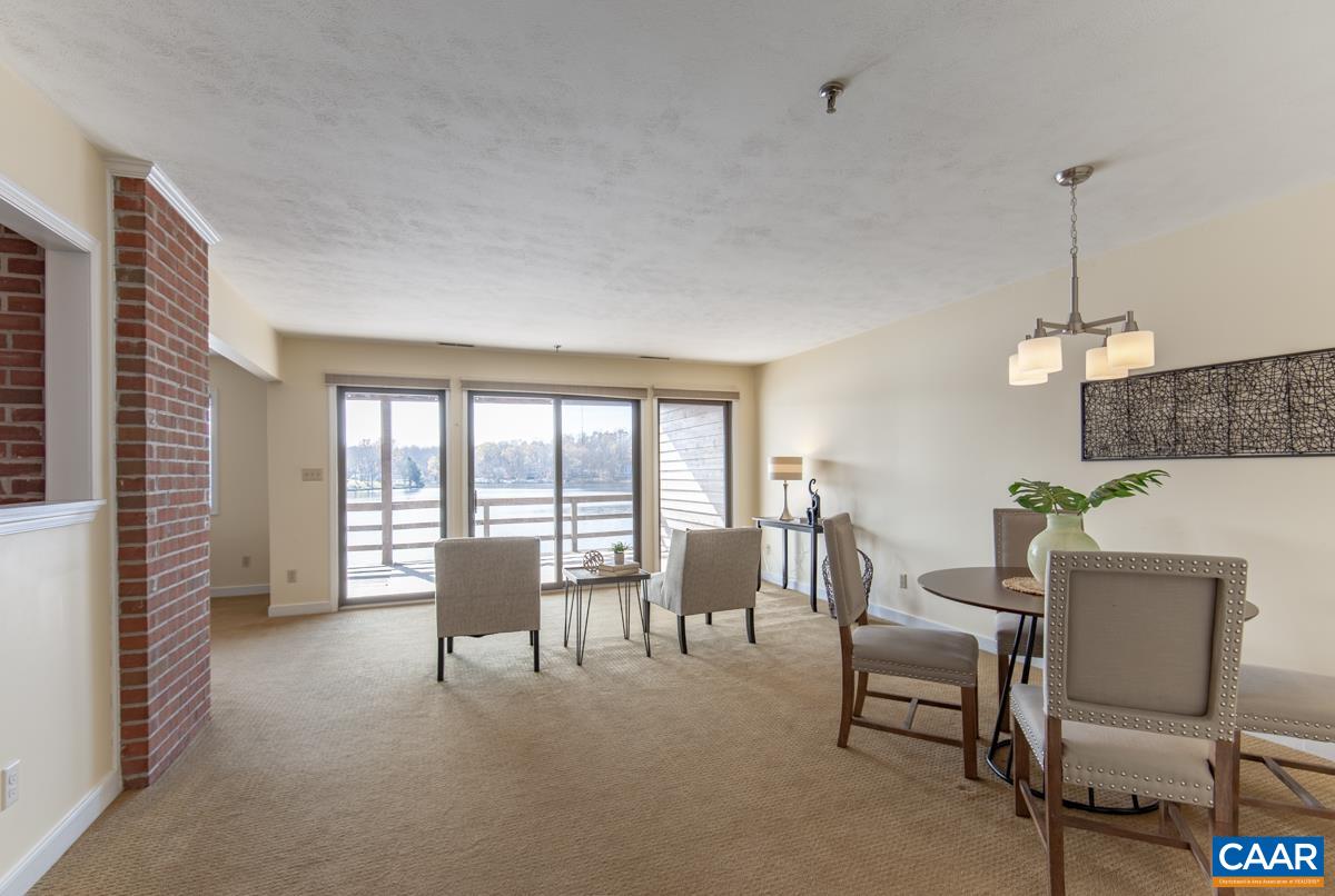 4 Marina Point Palmyra, VA 22963 - Photo 11 of 51 a living room with furniture and a floor to ceiling window