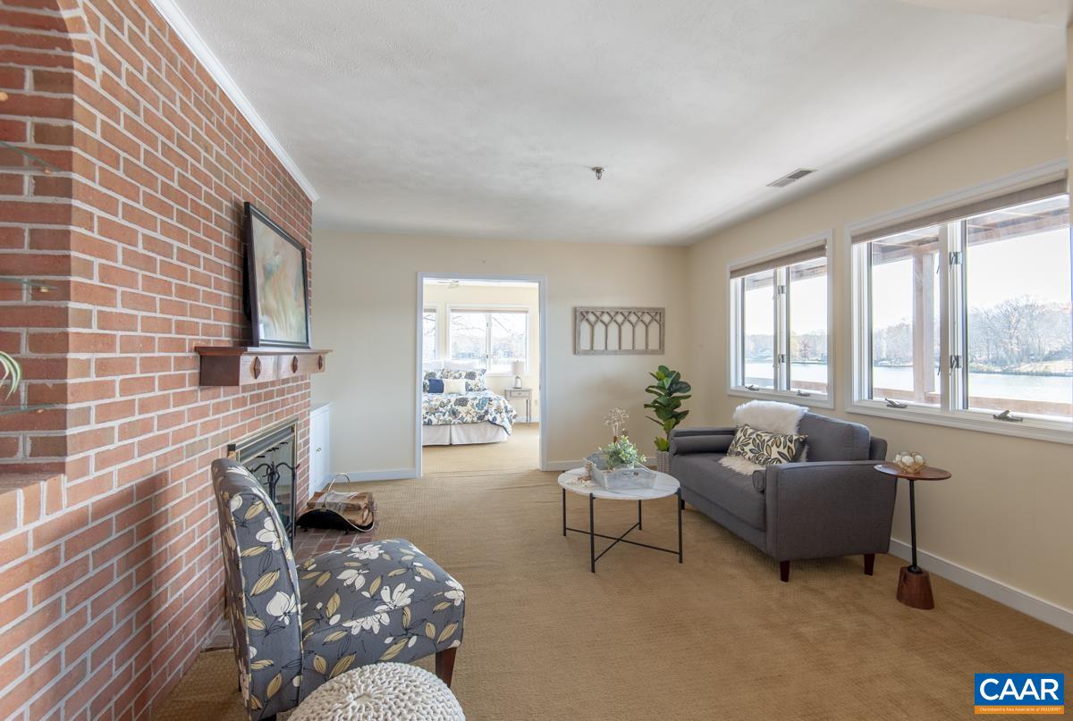 4 Marina Point Palmyra, VA 22963 - Photo 15 of 51 a living room with furniture and a flat screen tv
