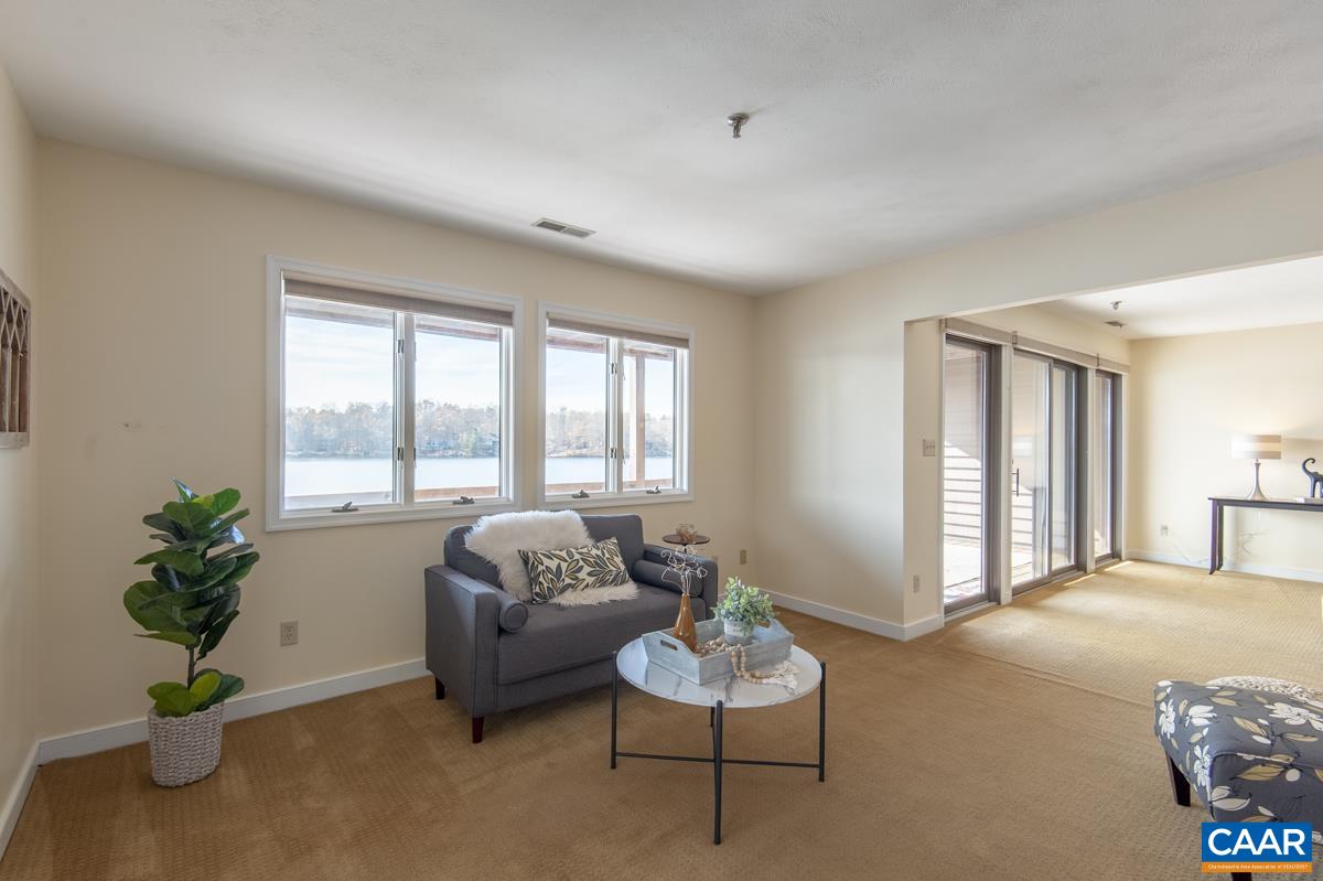 4 Marina Point Palmyra, VA 22963 - Photo 17 of 51 a living room with furniture and a potted plant
