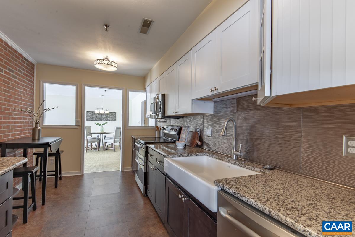 4 Marina Point Palmyra, VA 22963 - Photo 20 of 51 a kitchen with stainless steel appliances granite countertop a sink stove and refrigerator