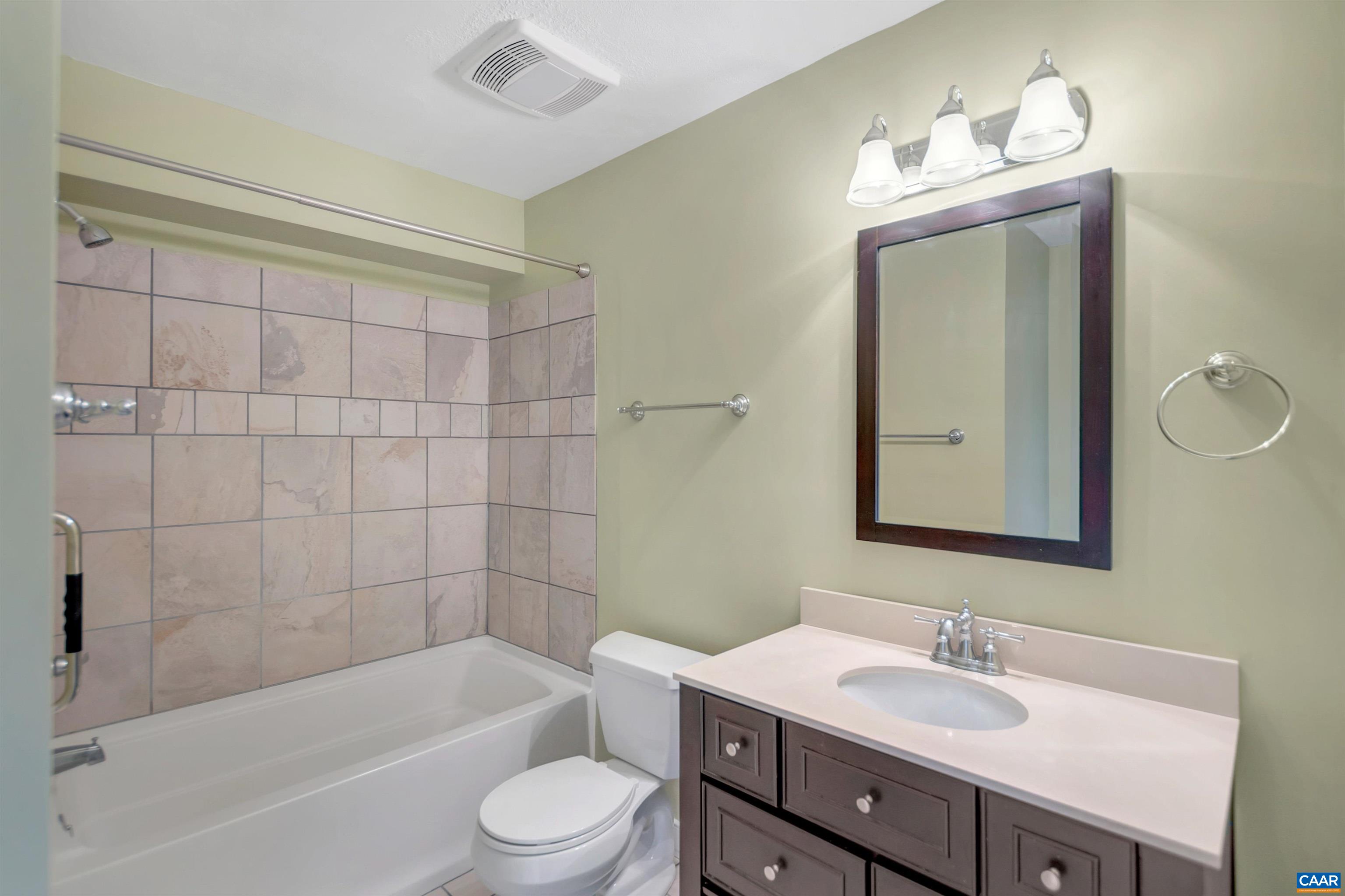 4 Marina Point Palmyra, VA 22963 - Photo 35 of 51 a bathroom with a toilet a sink a mirror a bathtub and vanity
