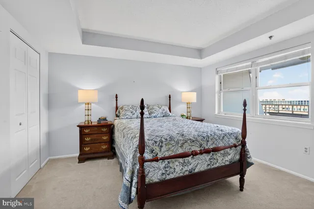 a bedroom with a bed and a table