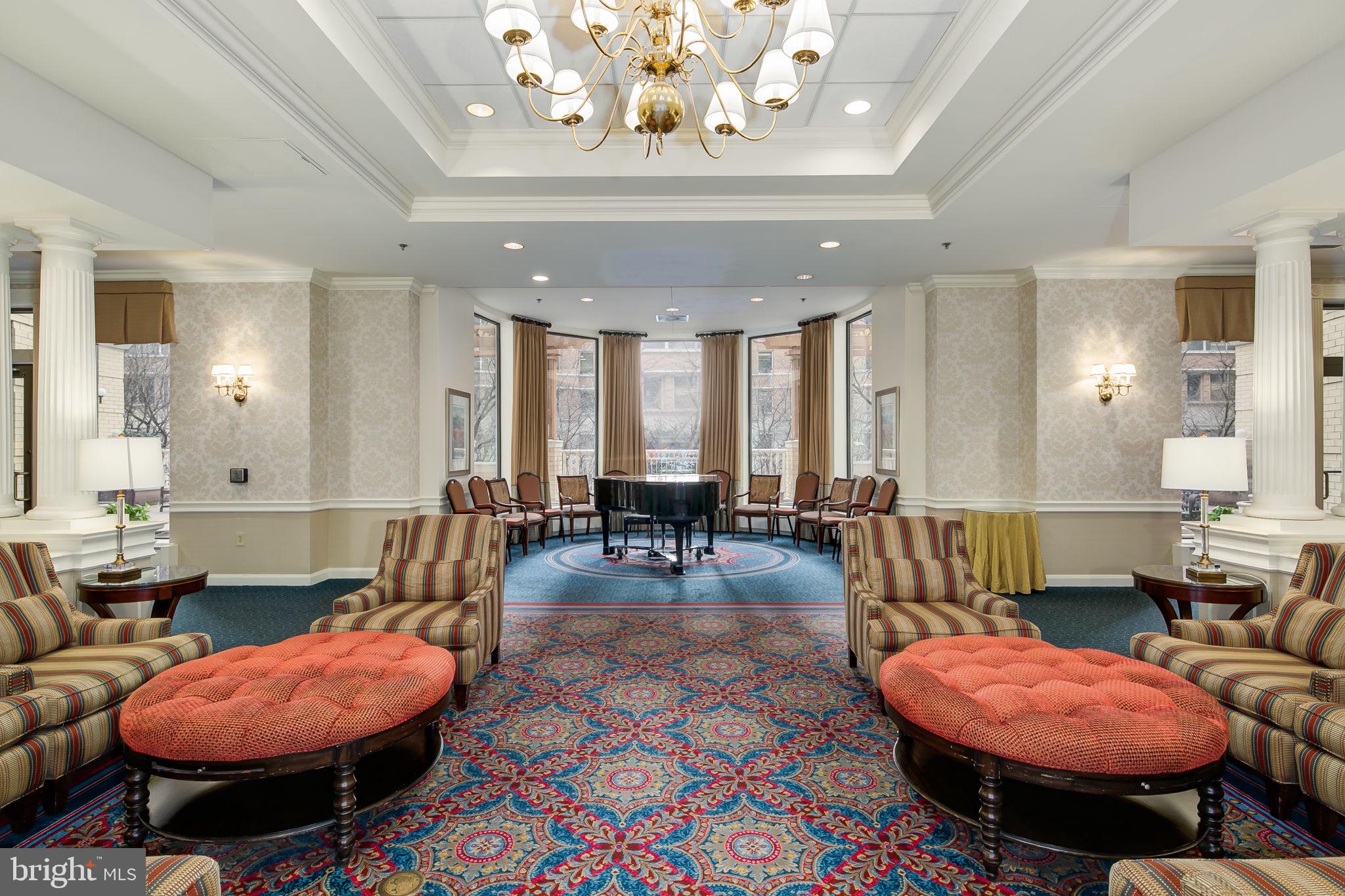 900 North Taylor Street, Unit 909 Arlington, VA 22203 - Photo 29 of 42 a living room with furniture a dining table and chairs