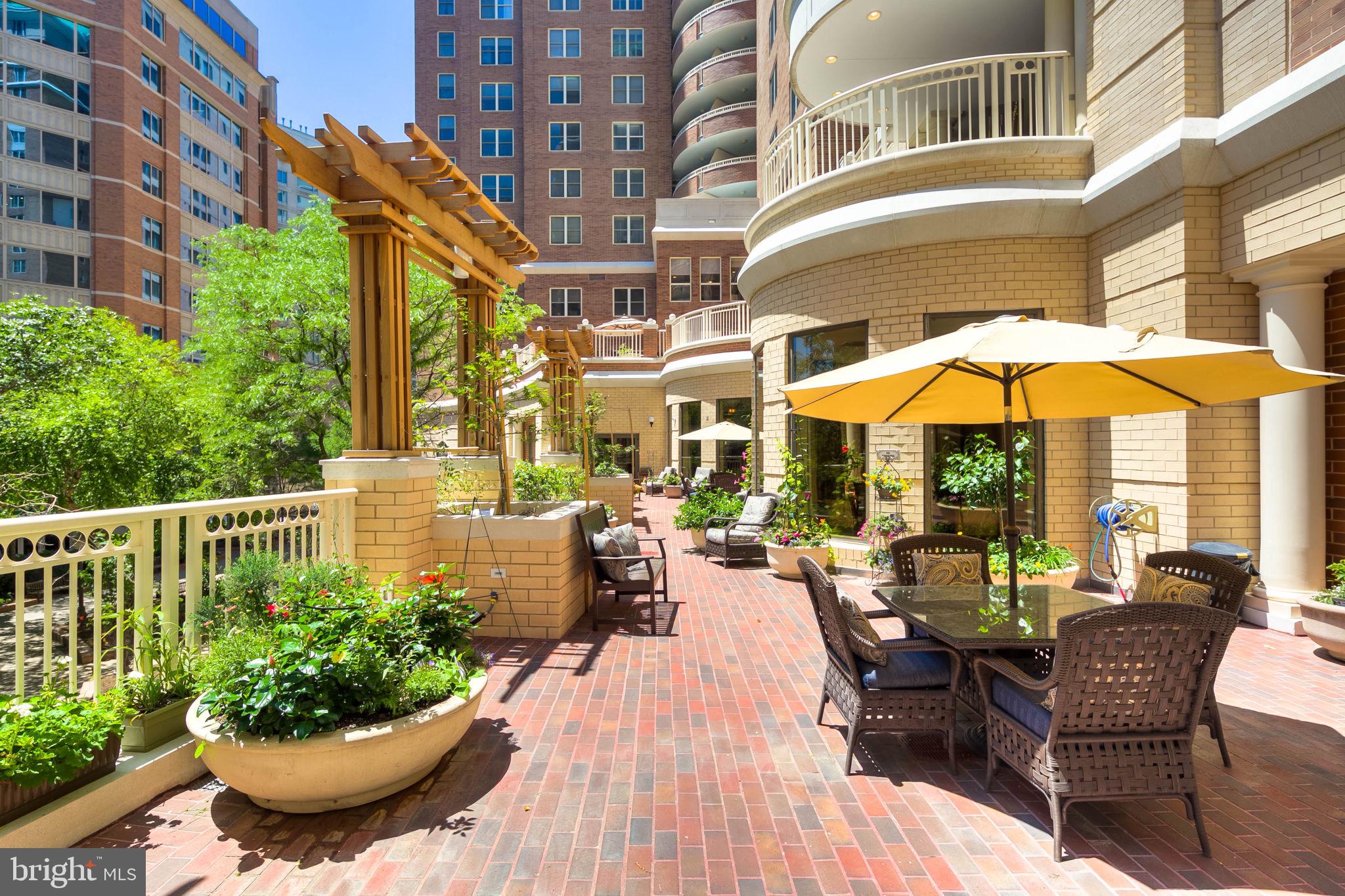 900 North Taylor Street, Unit 909 Arlington, VA 22203 - Photo 35 of 42 a view of a patio with furniture and a potted plants