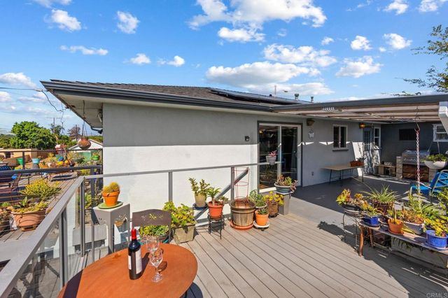 a view of a chairs and table in backyard