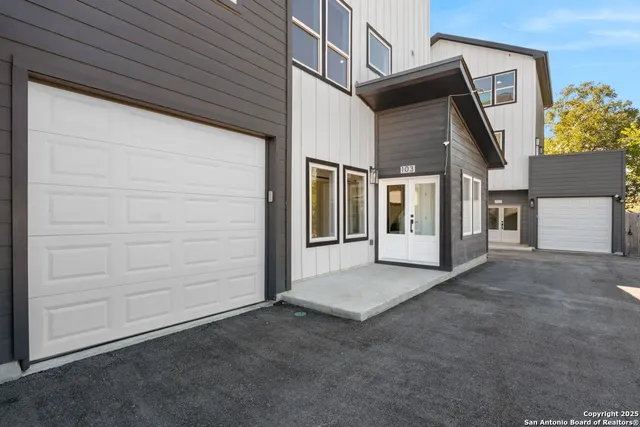 a view of front door and yard