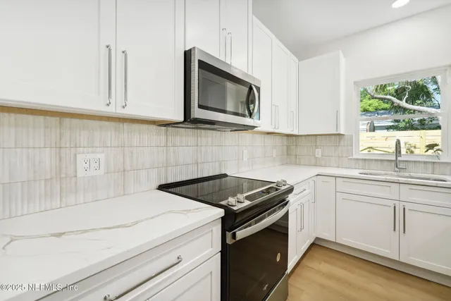 a sink sitting next to a window