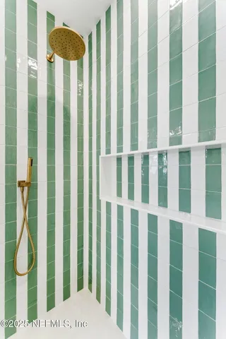 an empty room with window and fan