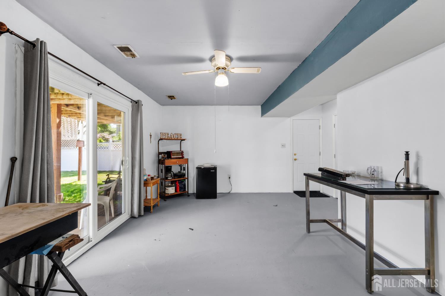 245 4th Street Dunellen, NJ 08812 - Photo 18 of 27 a view of a livingroom with workspace and a window