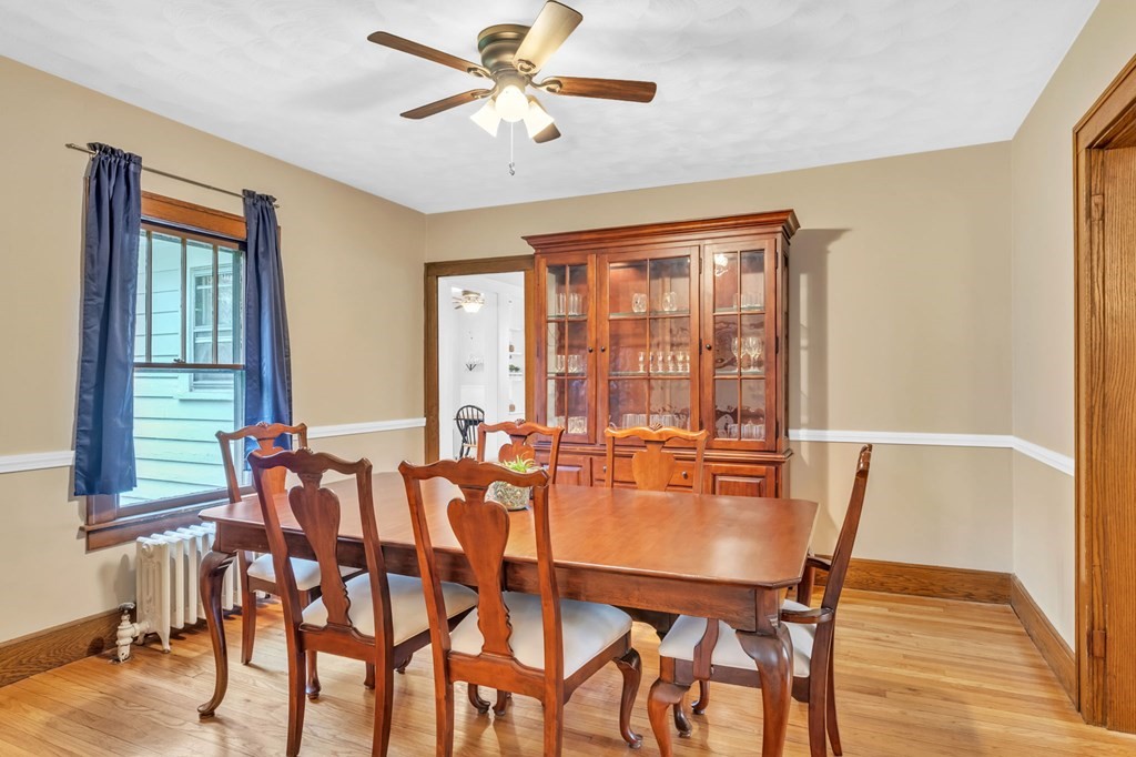 108 Manchester Terrace Springfield, MA 01108 - Photo 14 of 40 a dining room with furniture a chandelier and wooden floor