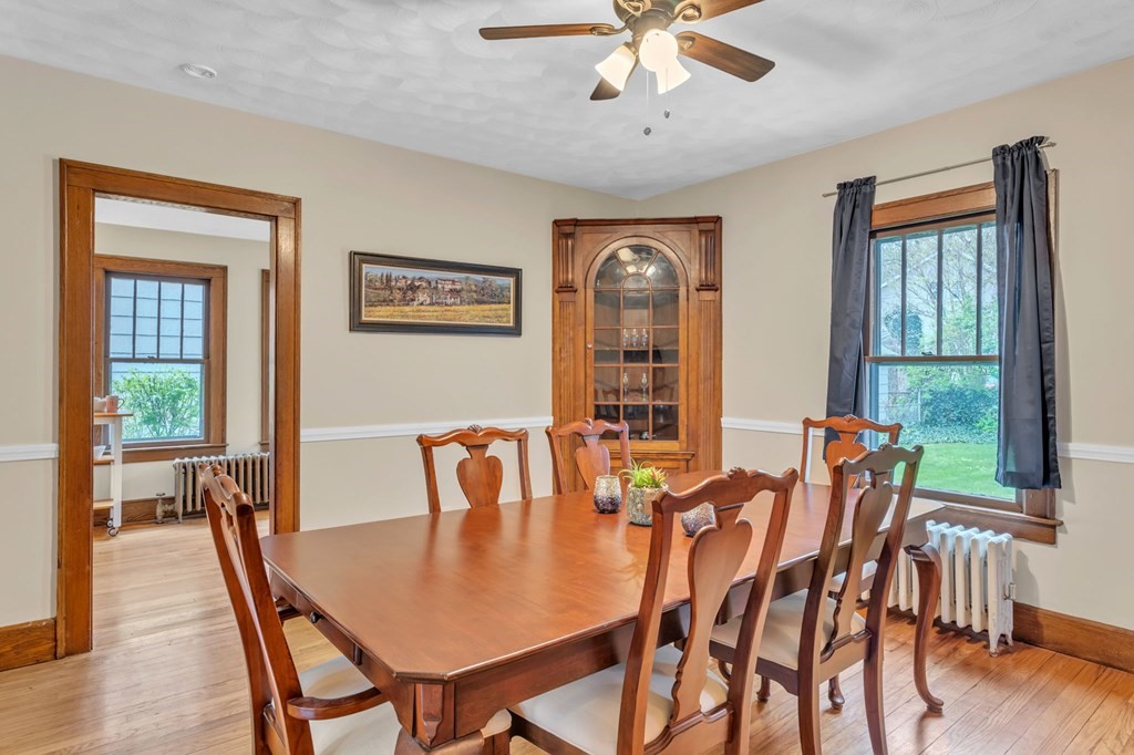 108 Manchester Terrace Springfield, MA 01108 - Photo 16 of 40 a view of a dining room with furniture window and wooden floor