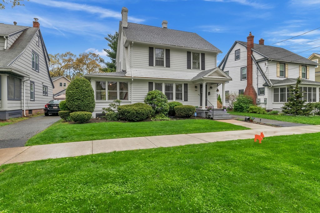 108 Manchester Terrace Springfield, MA 01108 - Photo 2 of 40 a front view of a house with a yard