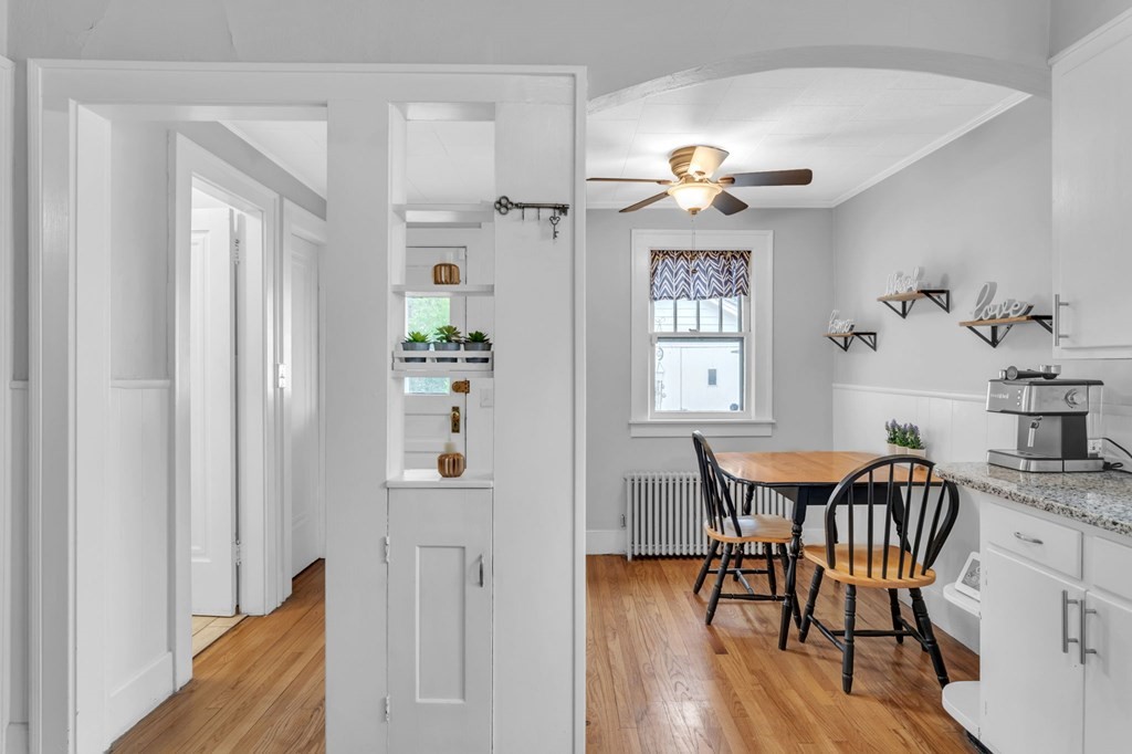 108 Manchester Terrace Springfield, MA 01108 - Photo 21 of 40 a dining room with furniture a chandelier and wooden floor