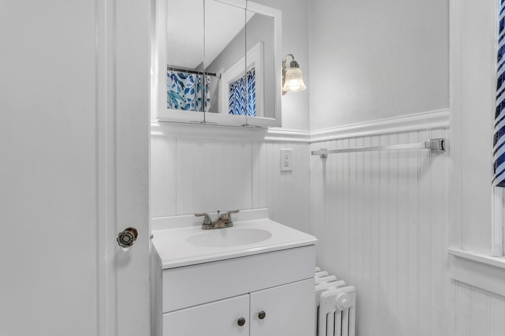 108 Manchester Terrace Springfield, MA 01108 - Photo 31 of 40 a bathroom with a sink and mirror